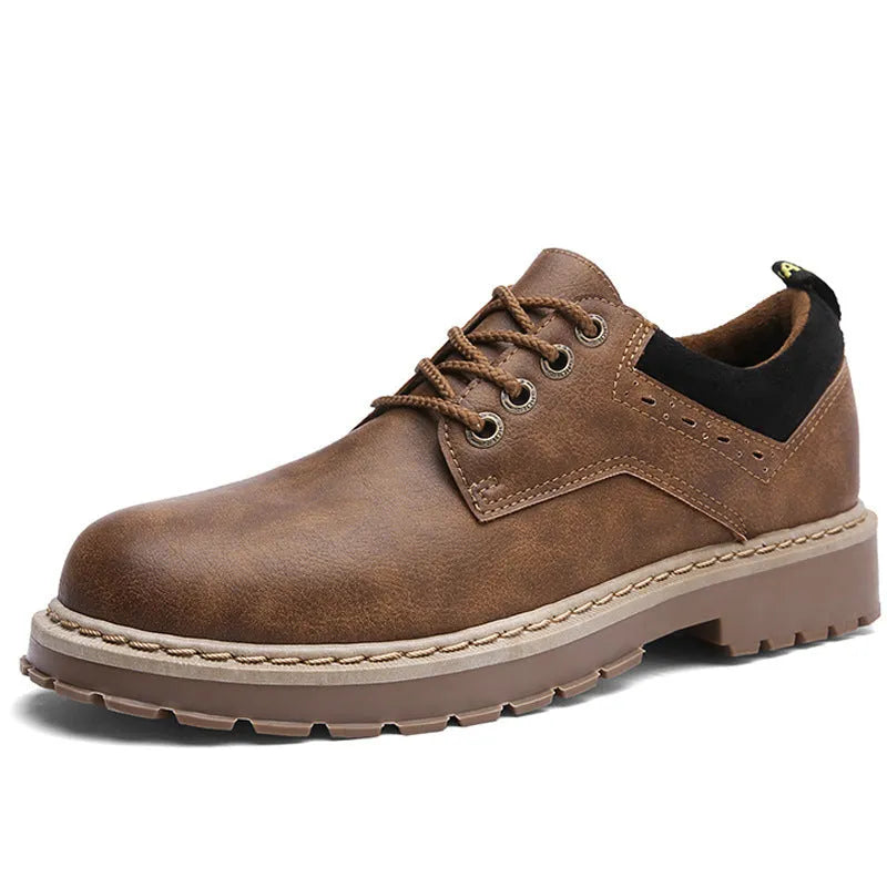 Men's black casual shoes with round toe, flat heel, and front-tie laces on a rubber sole.