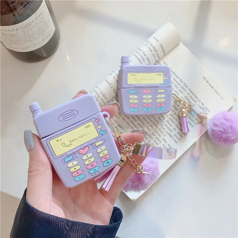Purple silicone protective case for Apple AirPods with attached white fur ball pendant