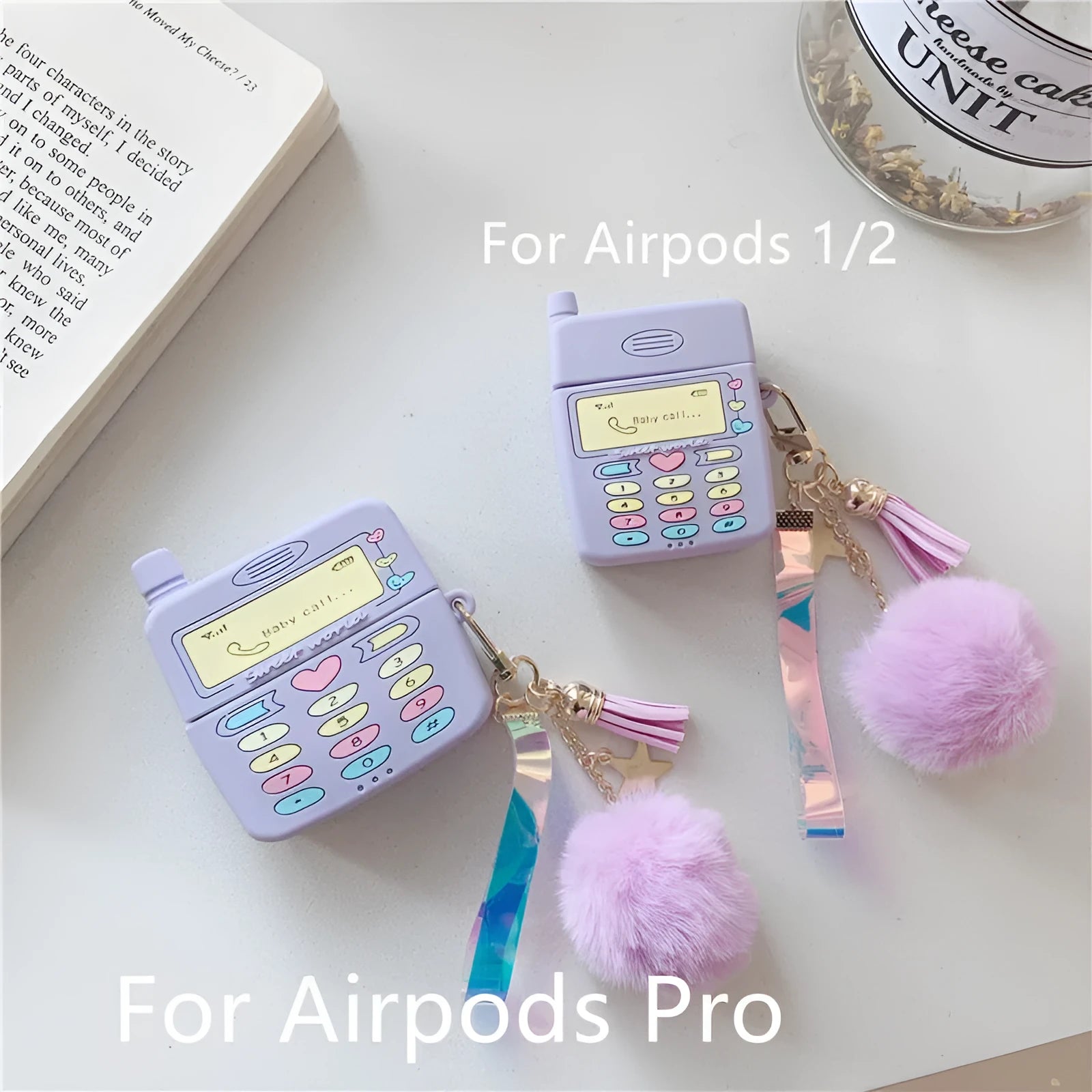 Purple silicone protective case for Apple AirPods with attached white fur ball pendant