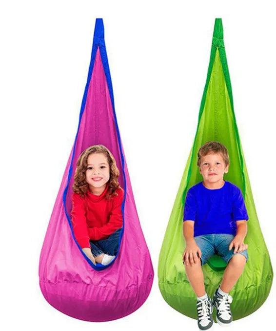 Green cotton pod swing chair hanging outdoors with inflatable cushion