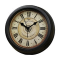Round European style retro desk clock with silent alarm on a wooden surface.