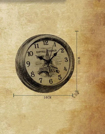 Round European style retro desk clock with silent alarm on a wooden surface.