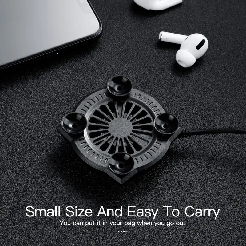 Black smartphone cooling fan with suction cup mount attached to mobile phone