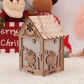 Three wooden Christmas ornaments: small log bell, wooden house with Santa, wooden house with snowman in natural wood colour