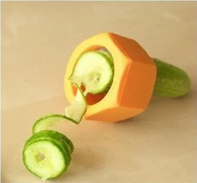 Yellow and green spiral vegetable cutter kitchen gadget for slicing cucumbers.
