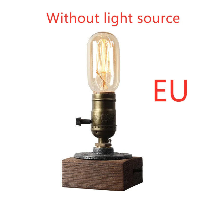 Small wooden and iron water pipe table lamp on a table