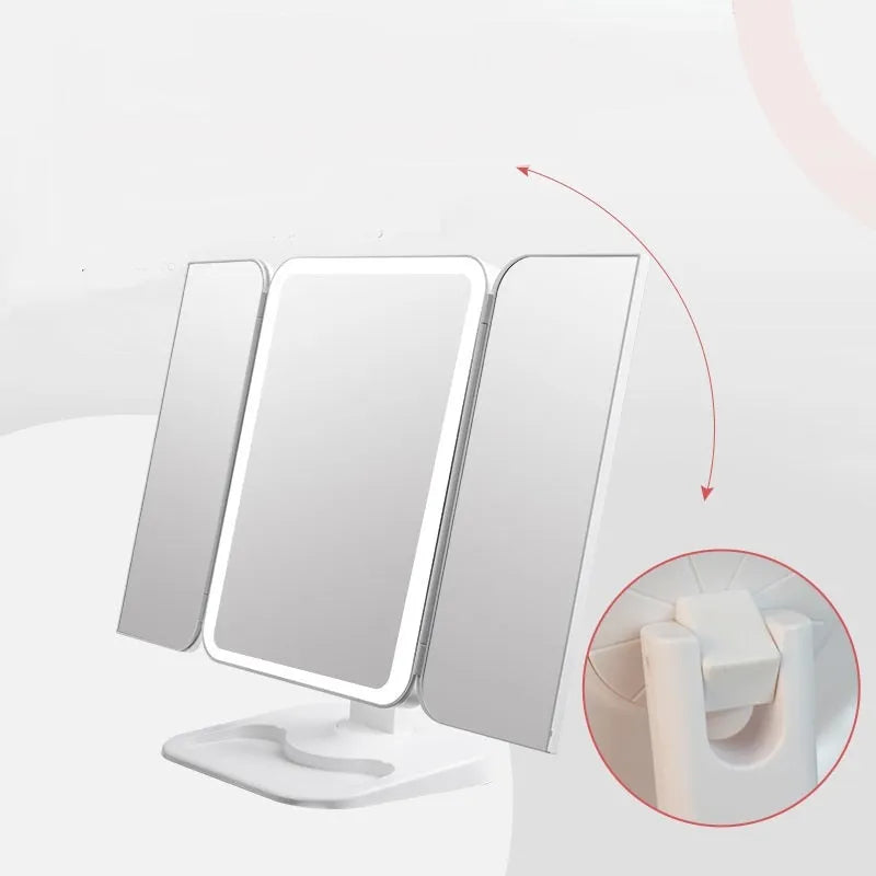 Trifold LED makeup mirror with 68 lights, 10X detachable magnifier, silver surface, rotating 180 degrees on a tabletop
