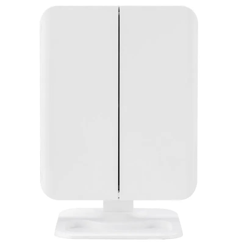 Trifold LED makeup mirror with 68 lights, 10X detachable magnifier, silver surface, rotating 180 degrees on a tabletop