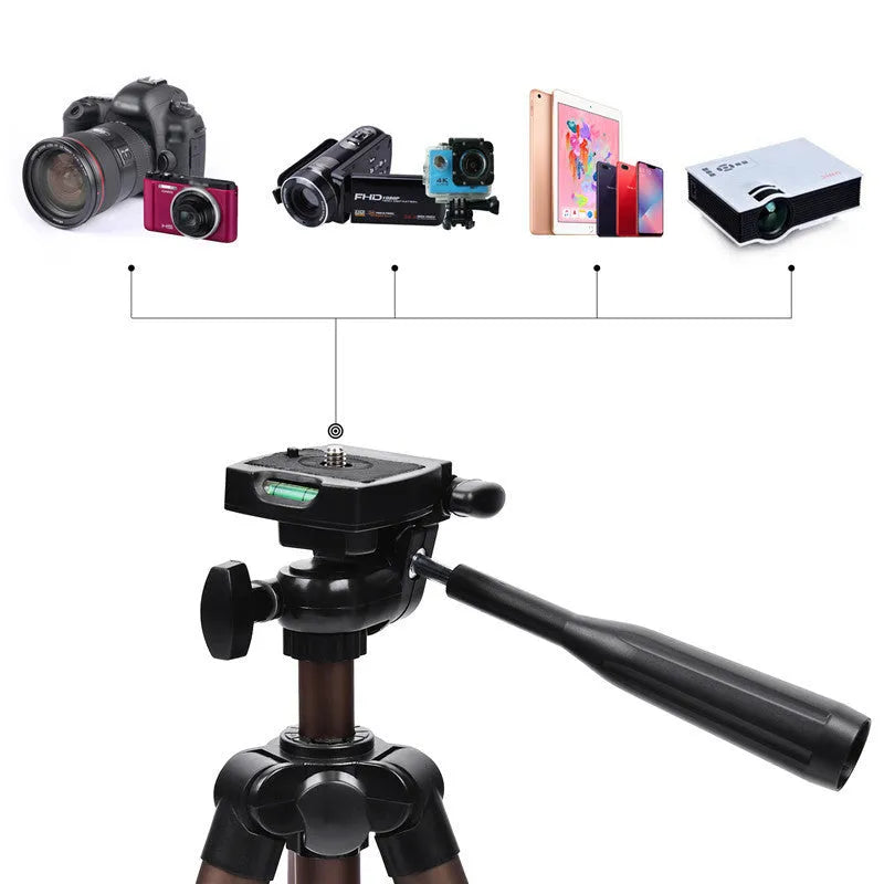 Black aluminium tripod extended to 1.3m with hydraulic head, mobile phone holder, and Bluetooth remote on a table.
