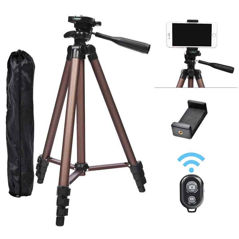 Black aluminium tripod extended to 1.3m with hydraulic head, mobile phone holder, and Bluetooth remote on a table.