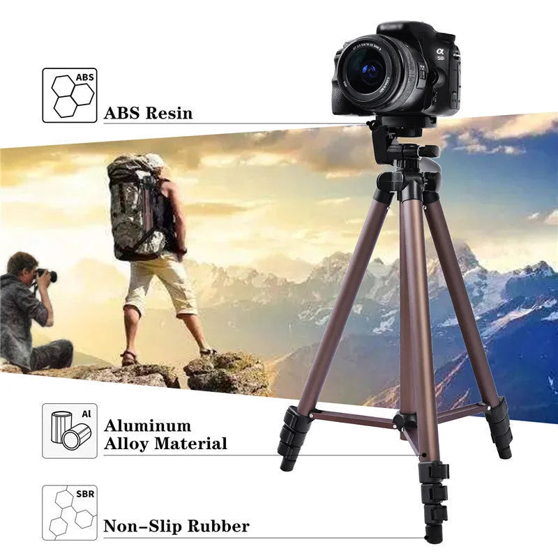 Black aluminium tripod extended to 1.3m with hydraulic head, mobile phone holder, and Bluetooth remote on a table.