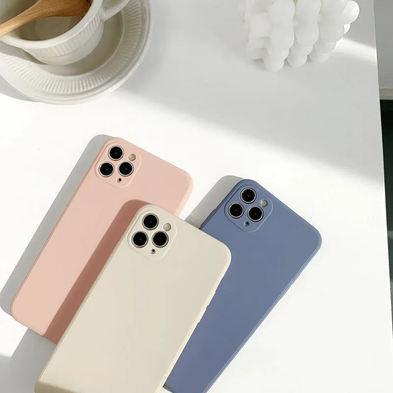 Slim solid colour silicone TPU case for iPhone on a table.