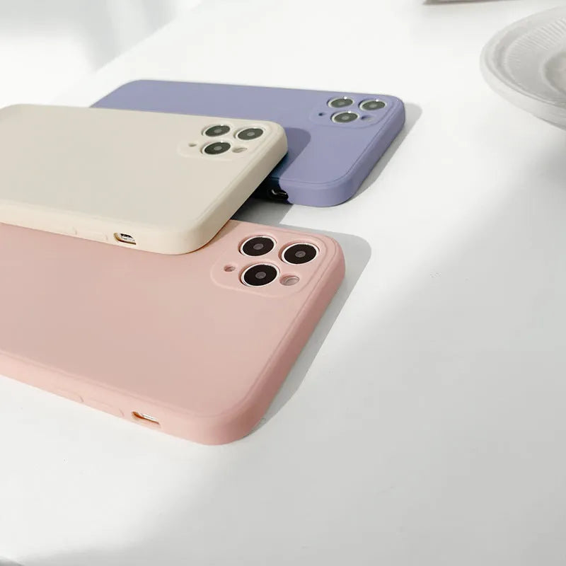 Slim solid colour silicone TPU case for iPhone on a table.
