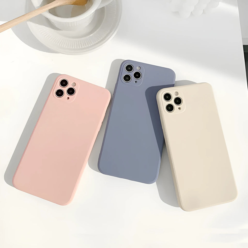Slim solid colour silicone TPU case for iPhone on a table.