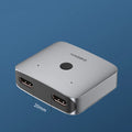 Gray HDMI splitter device with one input and two output ports for connecting multiple displays