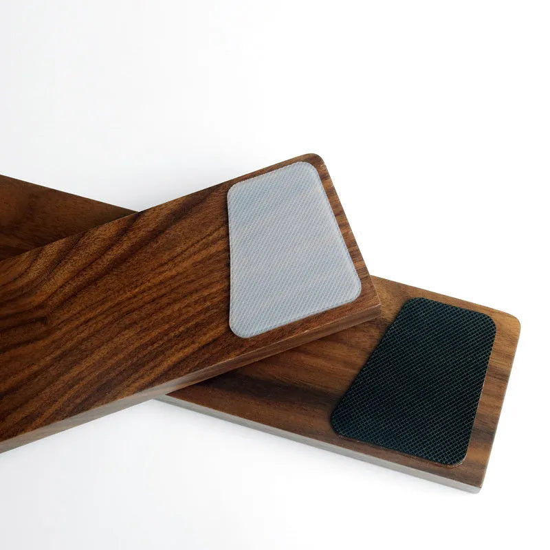 Solid walnut wood keyboard wrist rest for ergonomic forearm support.