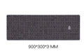Grey cloth gaming mouse wrist support pad on desktop surface
