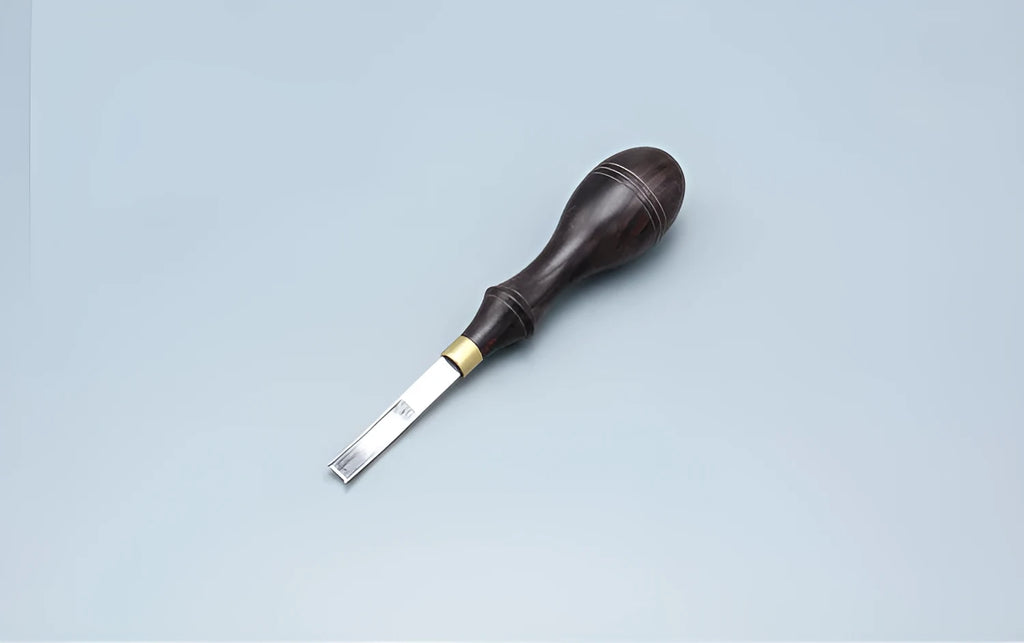 Model 02 leatherworking hand tool with wooden handle and wide metal shovel edge for thinning.
