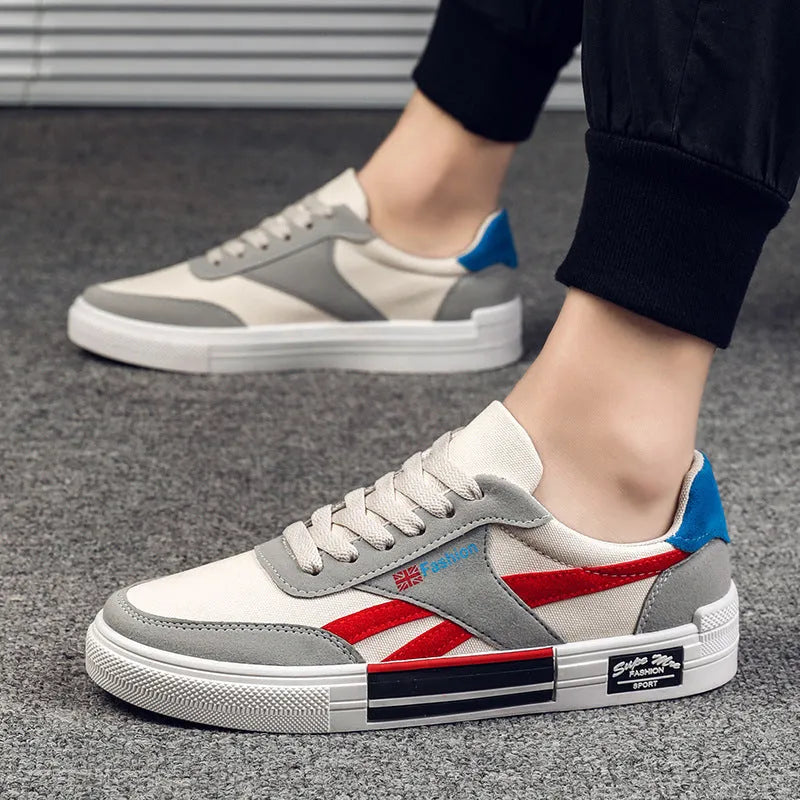 Men's canvas sneakers in black with rubber sole, round toe, and front tie lace closure.