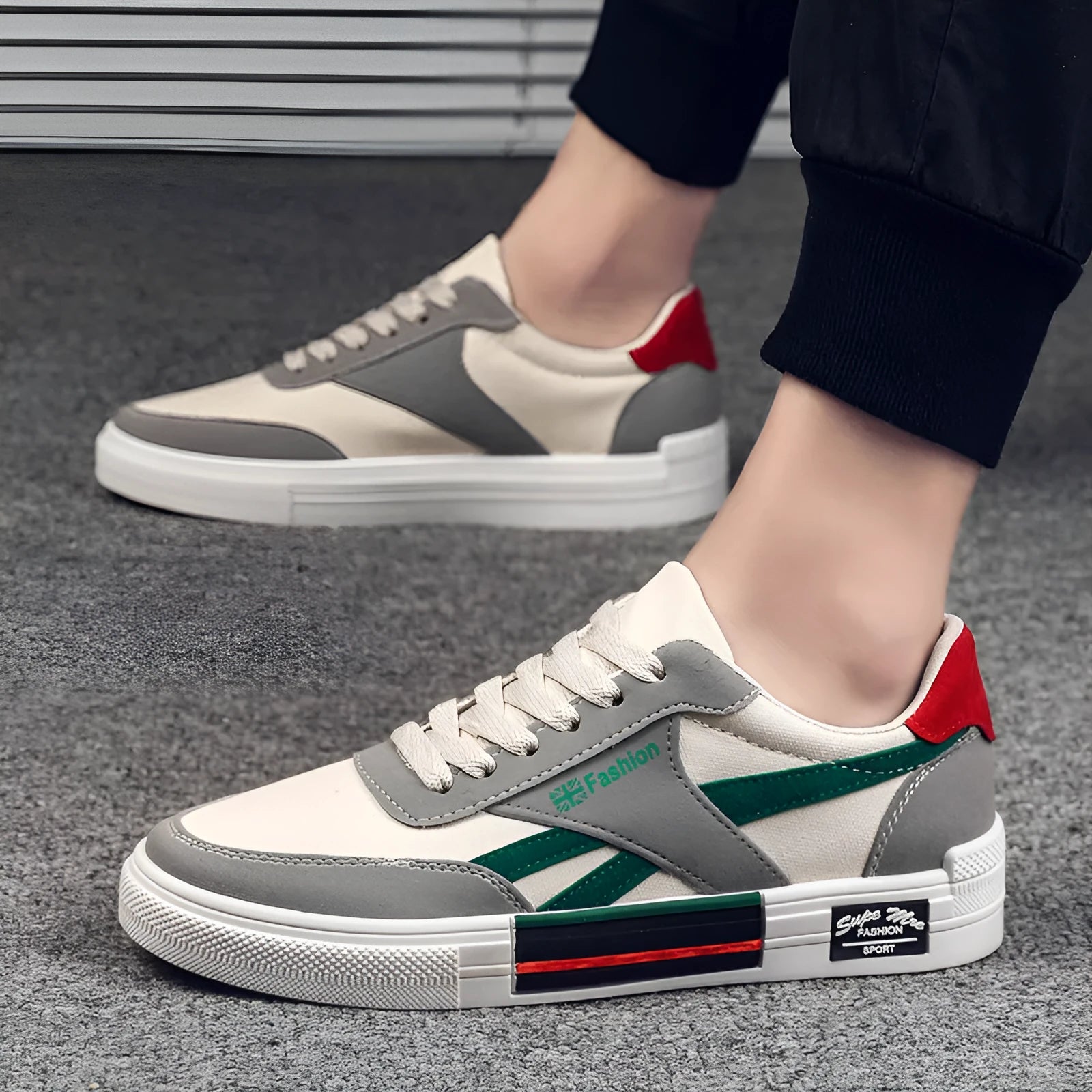 Men's canvas sneakers in black with rubber sole, round toe, and front tie lace closure.