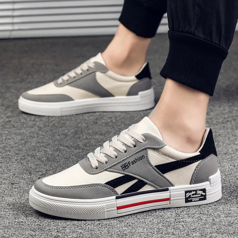 Men's canvas sneakers in black with rubber sole, round toe, and front tie lace closure.
