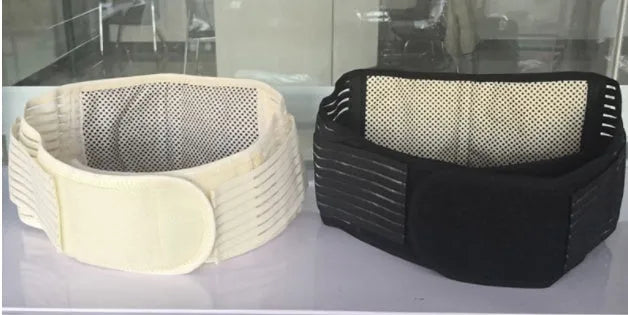 Black self-heating magnetic waist support belt laid flat, showing elastic cloth material and adjustable design.