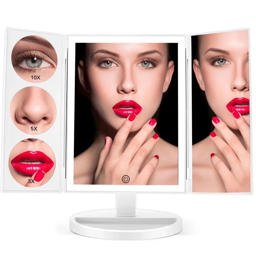 Trifold LED makeup mirror with 68 lights, 10X detachable magnifier, silver surface, rotating 180 degrees on a tabletop