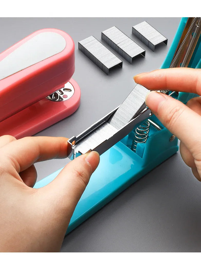 Black rotatable student stapler showing 360-degree head rotation and centre seam binding guide.