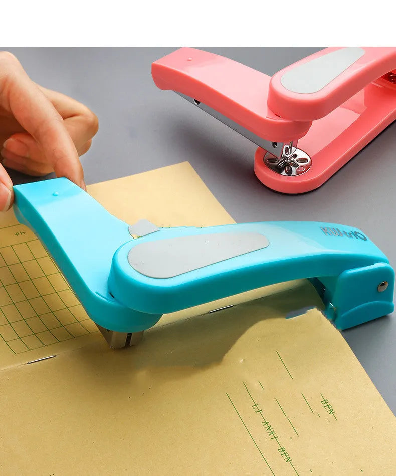 Black rotatable student stapler showing 360-degree head rotation and centre seam binding guide.