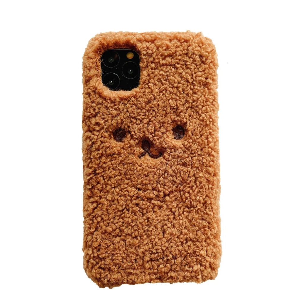 Brown embroidered plush bear face on a soft TPU iPhone phone case.