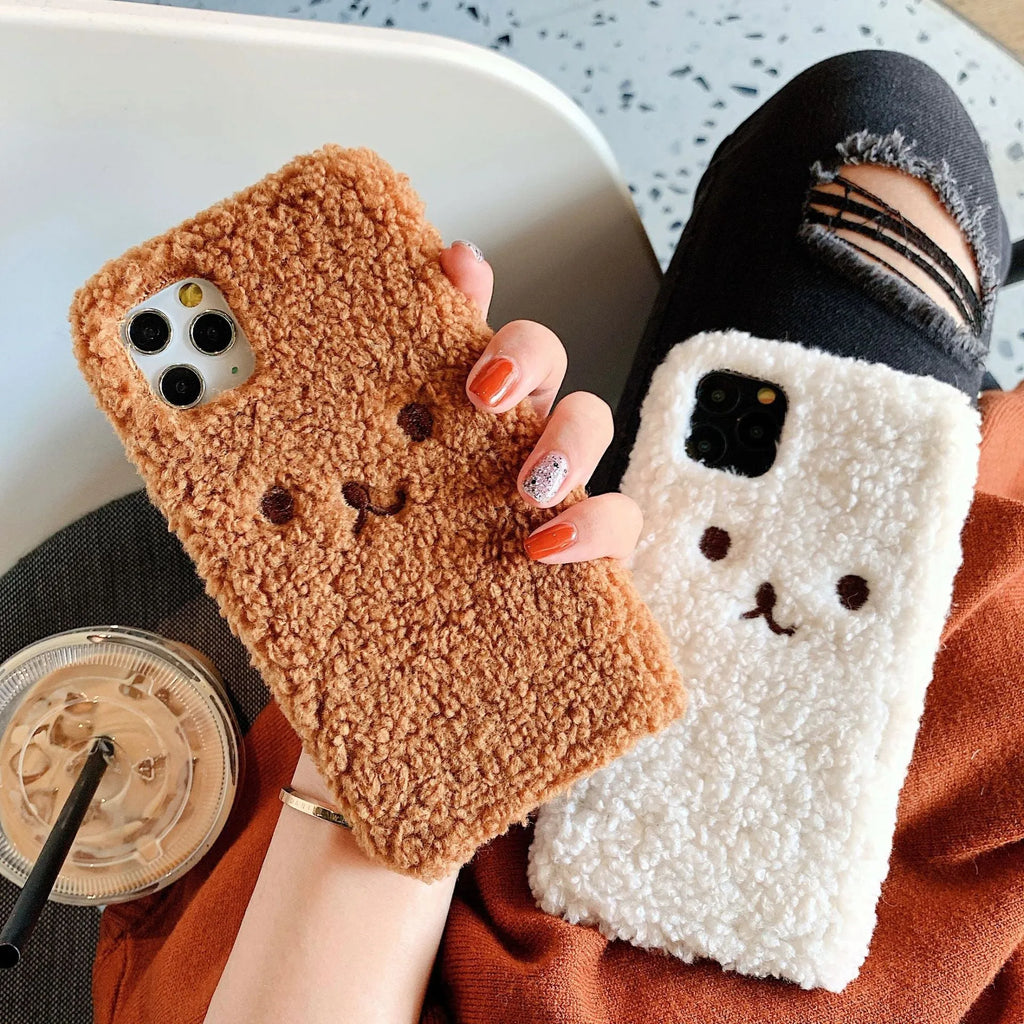 Brown embroidered plush bear face on a soft TPU iPhone phone case.