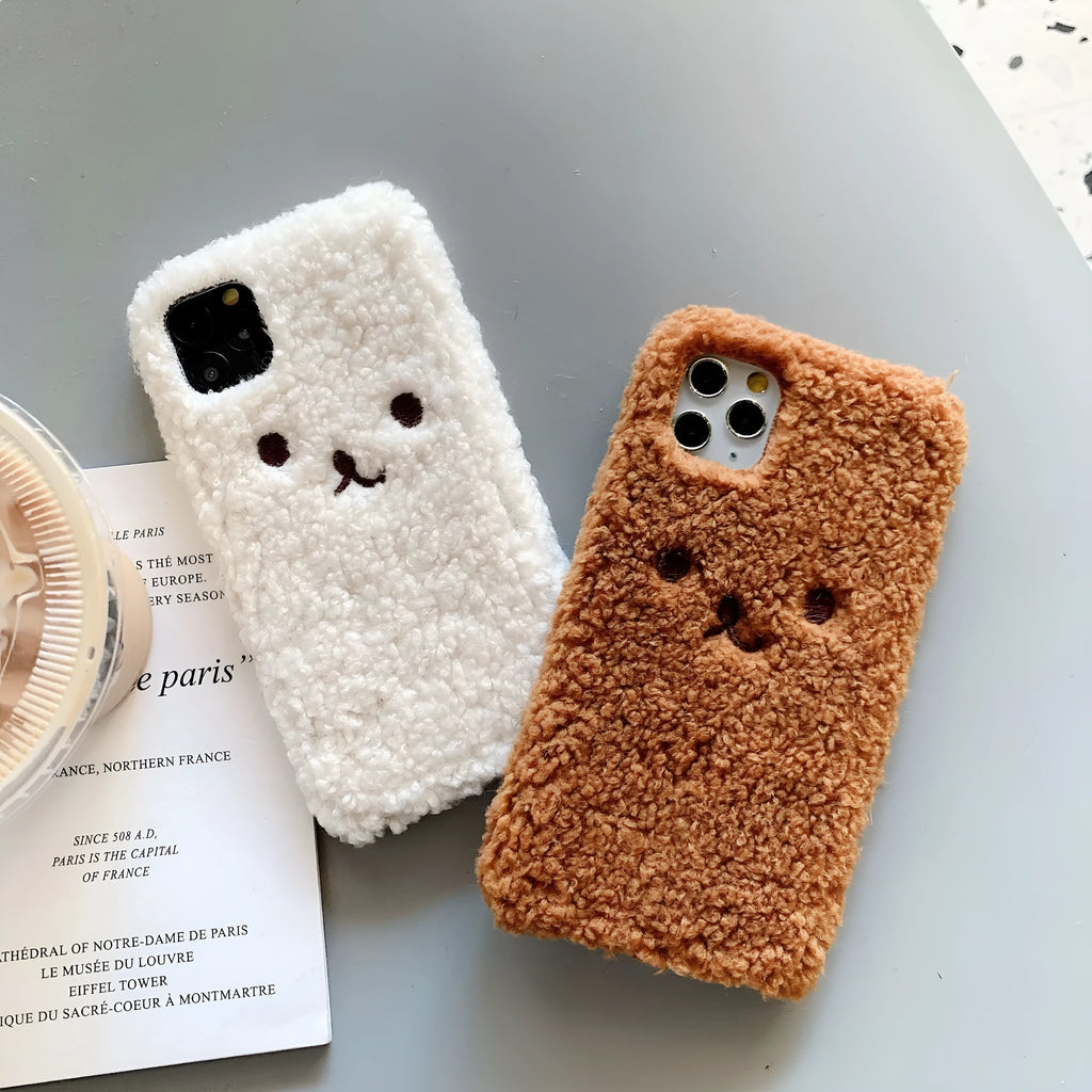 Brown embroidered plush bear face on a soft TPU iPhone phone case.