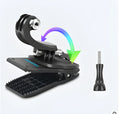 Silver and black action camera backpack clip mount with 360-degree rotating head on a backpack strap.
