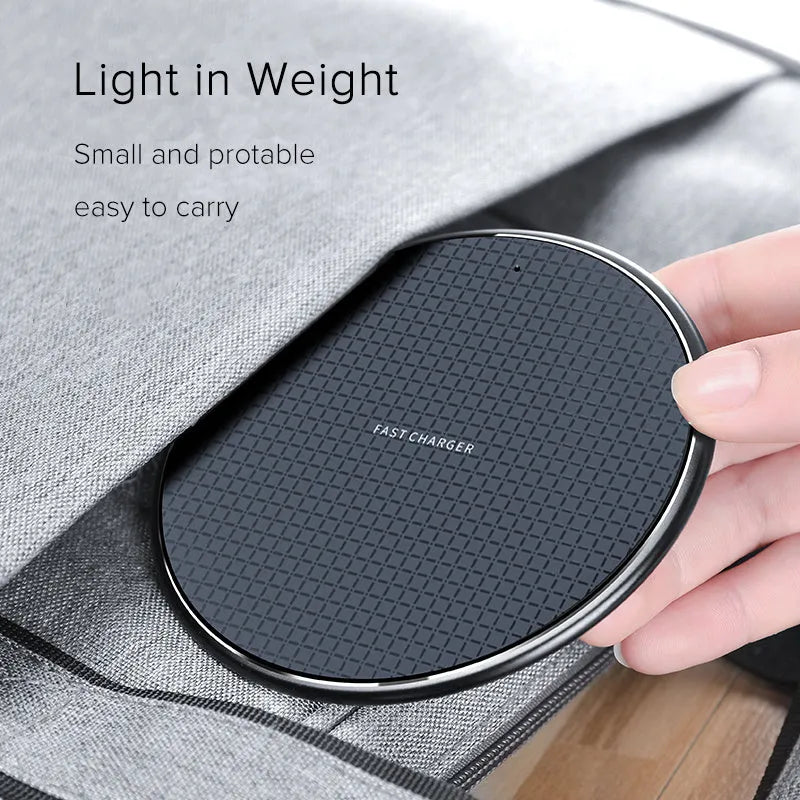 Round aluminium alloy 10W wireless phone charging pad with Qi receiver in black or grey.