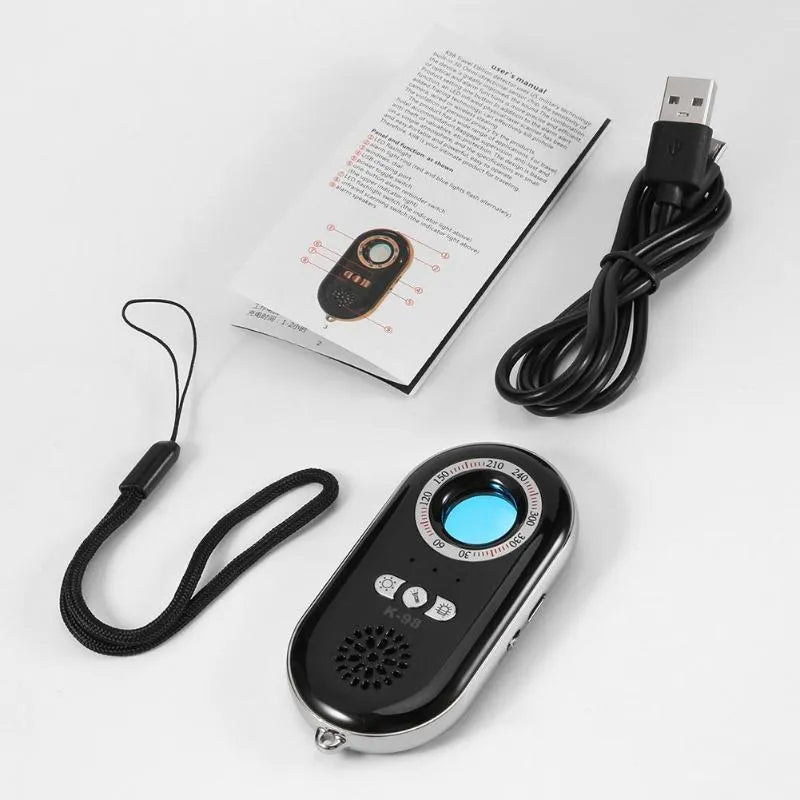 Compact white wireless signal detector with vibration sensor and alarm for travel security.