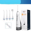White portable oral irrigator water flosser with a large water tank and multiple nozzles on a bathroom counter.
