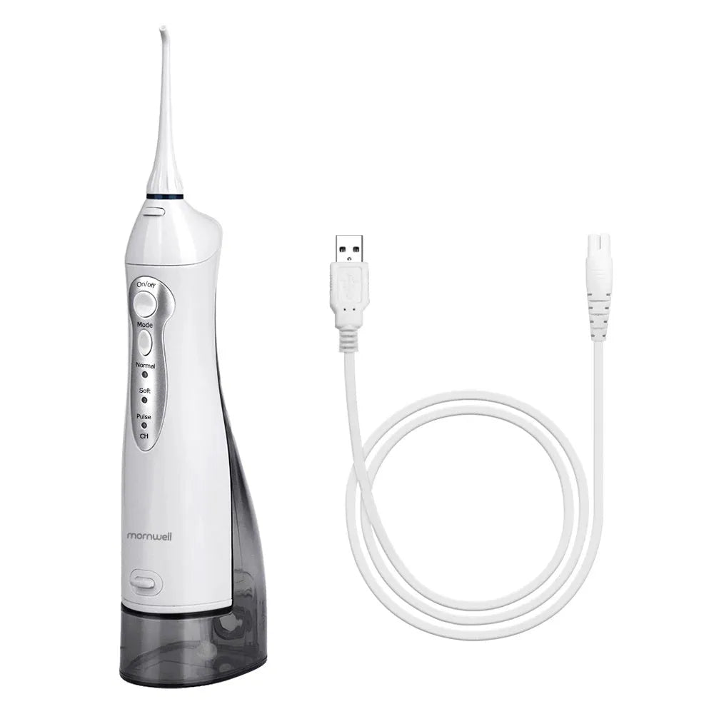 White portable oral irrigator water flosser with a large water tank and multiple nozzles on a bathroom counter.