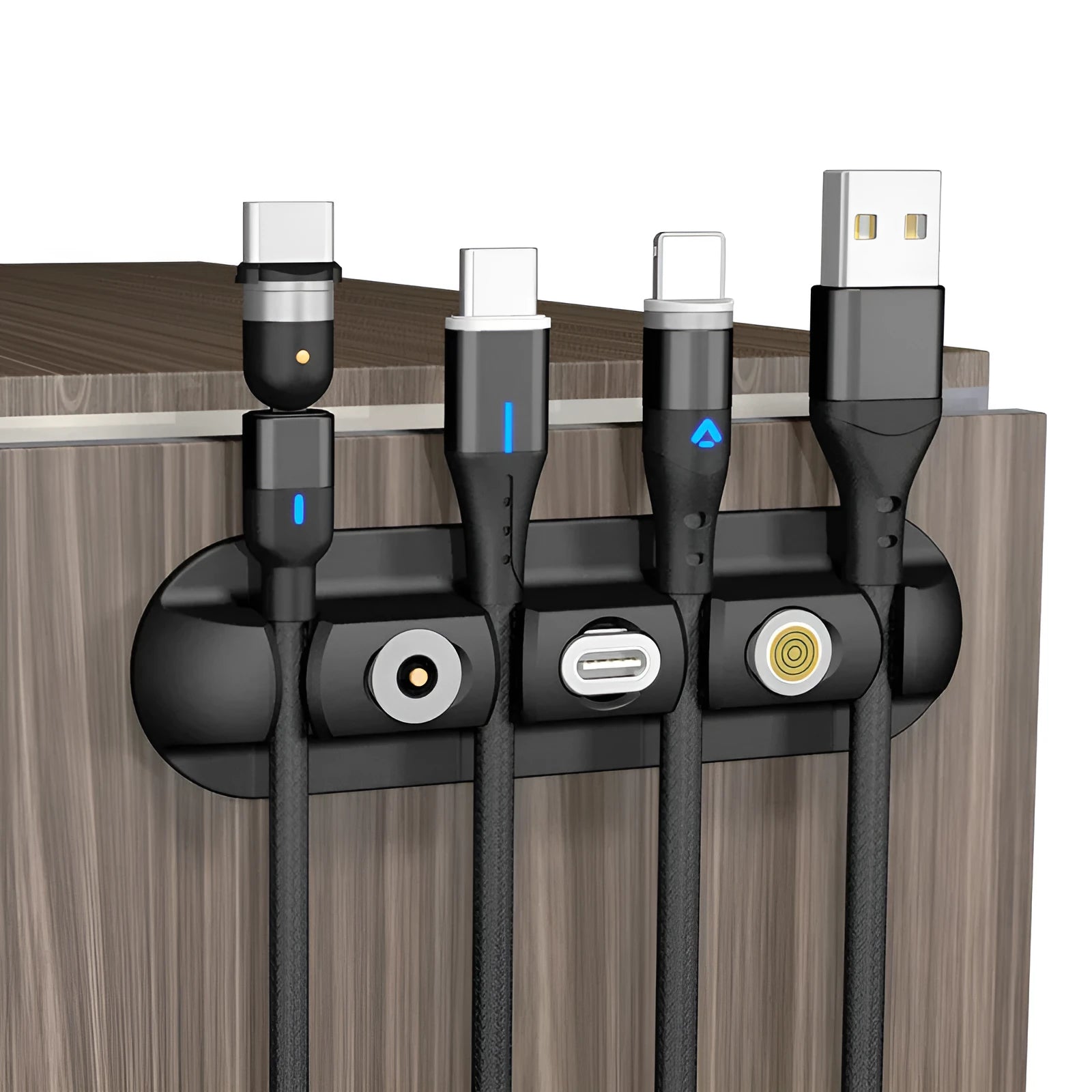 Black soft plastic desktop organiser holding magnetic charging cables on a wooden desk.