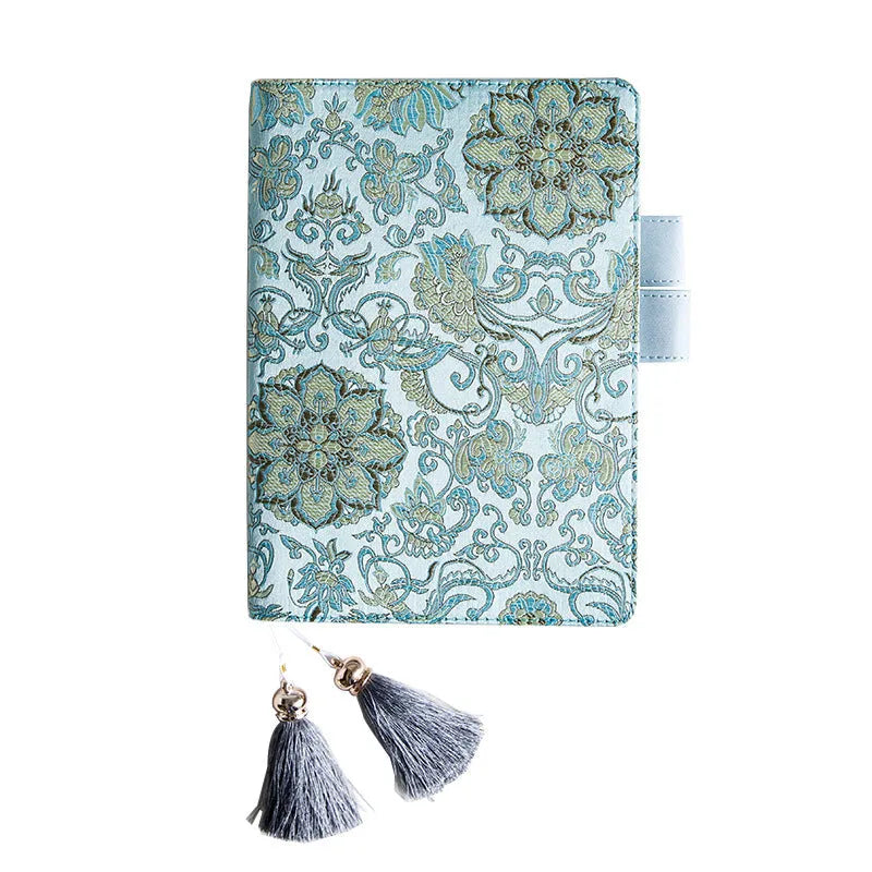 Blue floral fabric notebook open showing pages, available in A5 and A6 sizes.