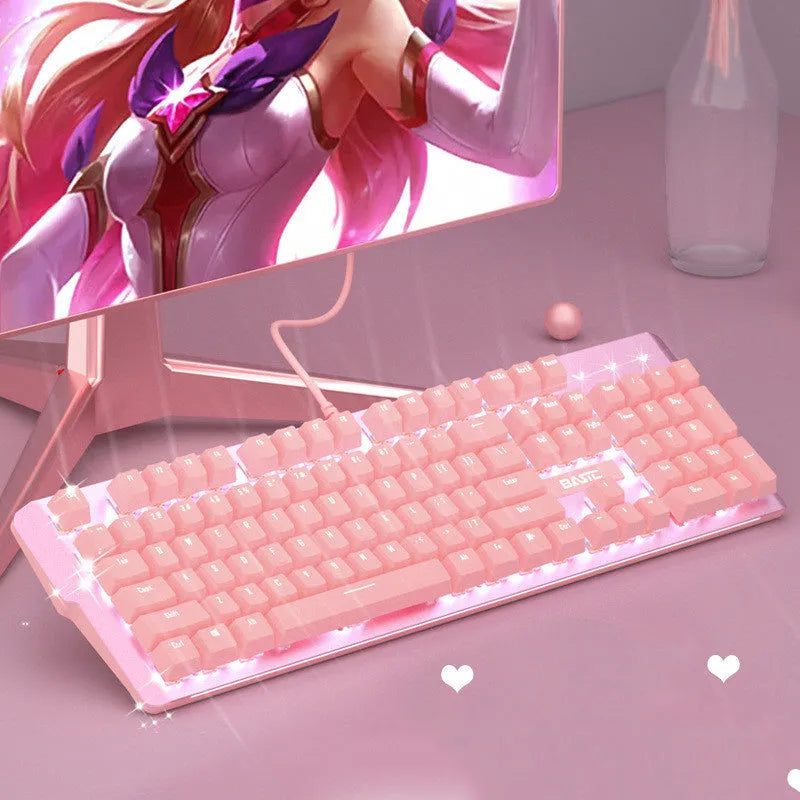 Pink wired mechanical keyboard and matching mouse set on a desk.