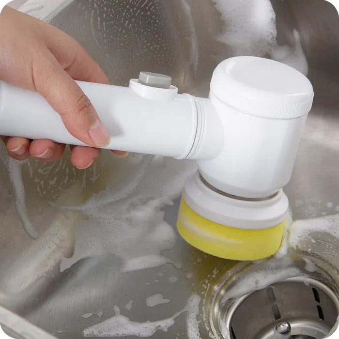 White electric cleaning brush with three interchangeable brush heads for household cleaning tasks