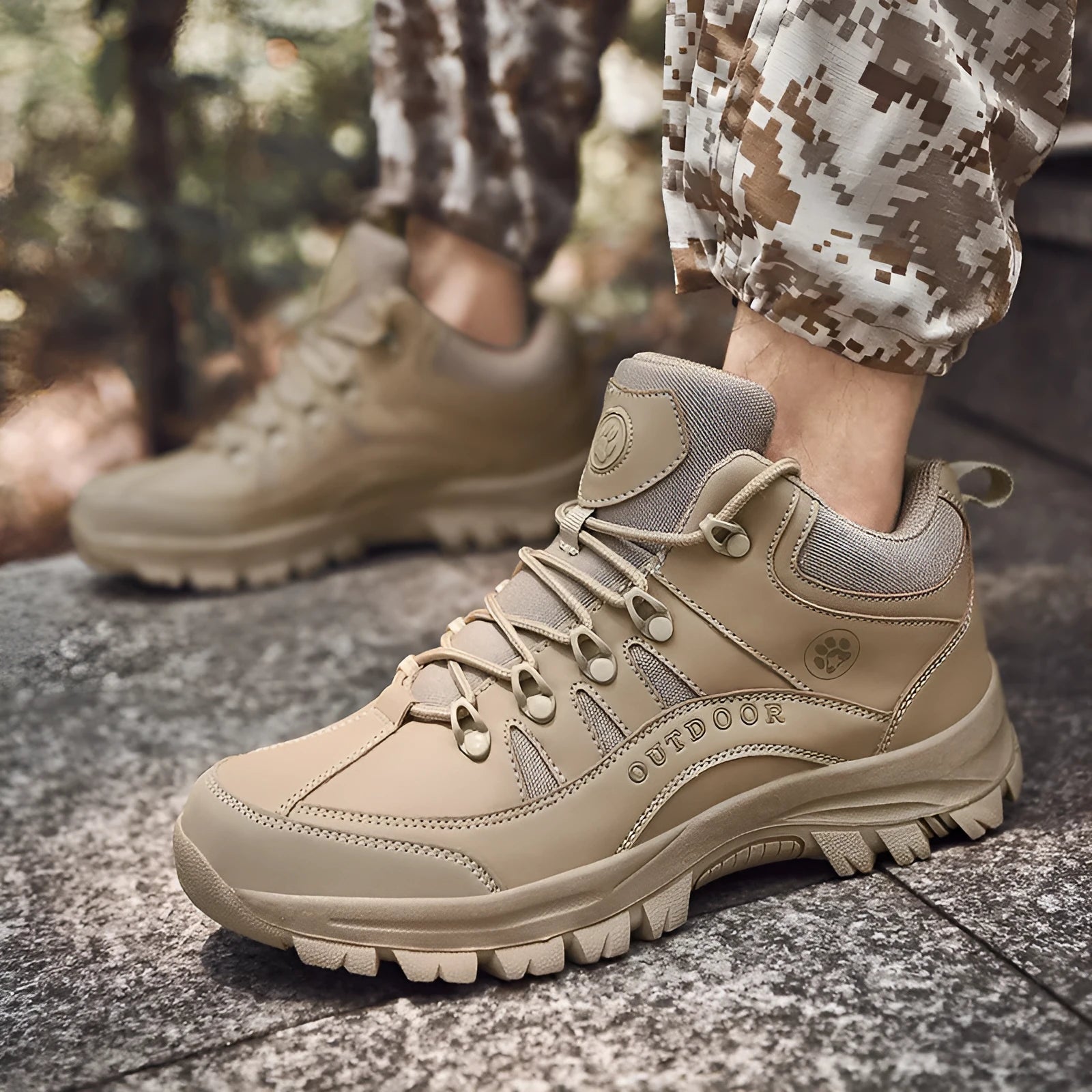 Men's military-style hiking boots in black with PU upper and rubber sole, shown on outdoor ground.