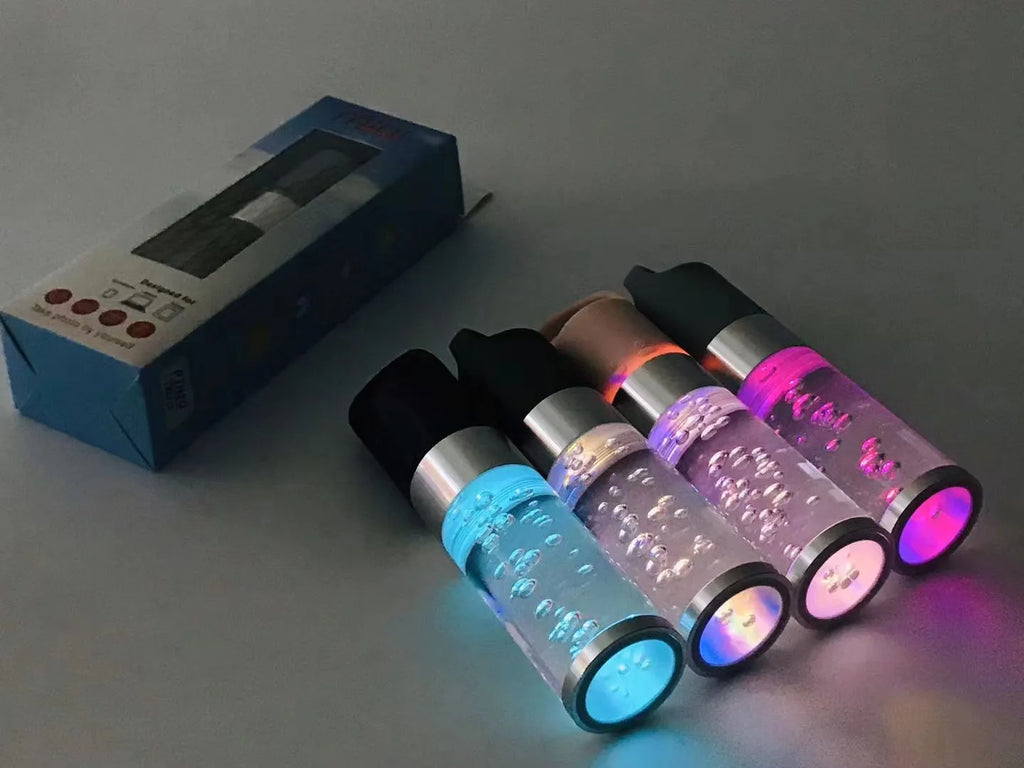 Colourful crystal light Bluetooth portable speaker in pink, black, silver grey, or green.