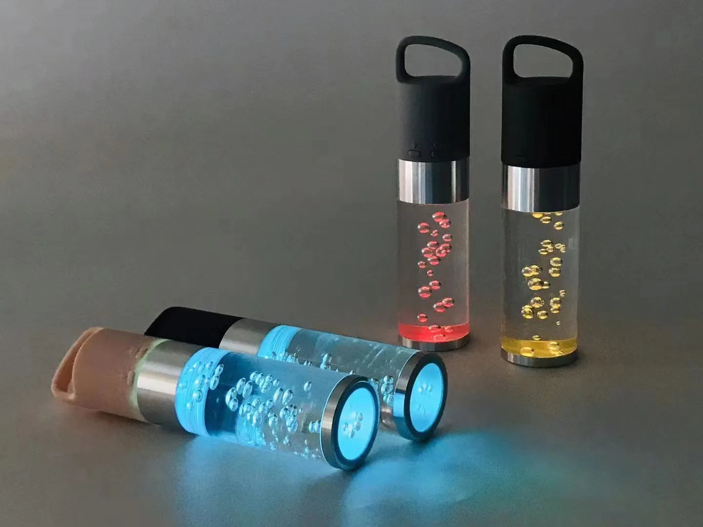 Colourful crystal light Bluetooth portable speaker in pink, black, silver grey, or green.