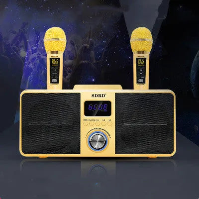 Black or gold Bluetooth karaoke speaker with two wireless microphones on charging stand