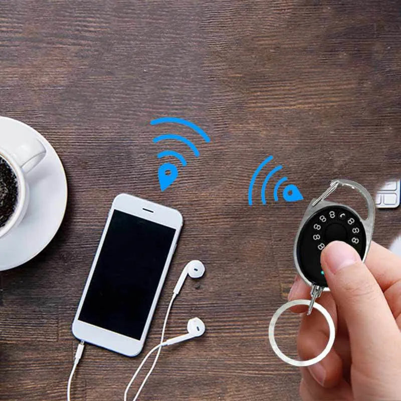 Black Bluetooth anti-lost tracker with keychain attachment and selfie remote function