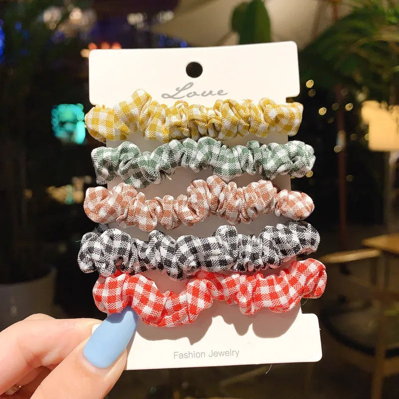 Set of children's hair rings and head ropes in autumn and macaron colours.