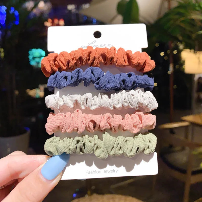 Set of children's hair rings and head ropes in autumn and macaron colours.