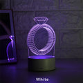 3D diamond ring design LED night light with colour changing modes on a black background.