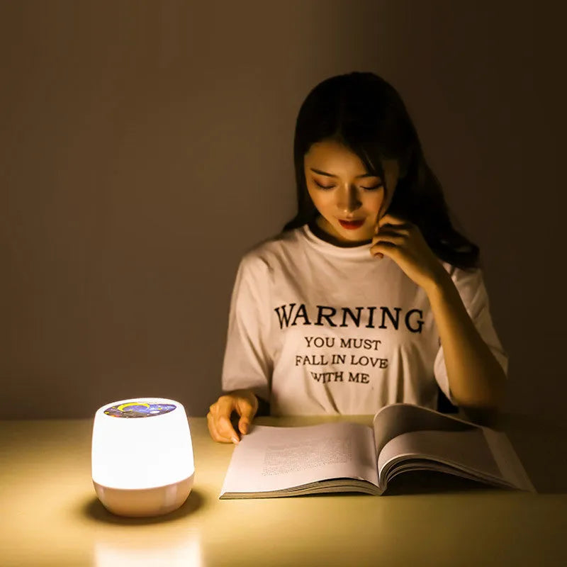 Pruixin rotating LED projector night light displaying star patterns on a bedroom ceiling.